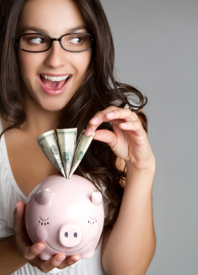 Woman Smilling with a Piggy Bank Dollars Fan Out
